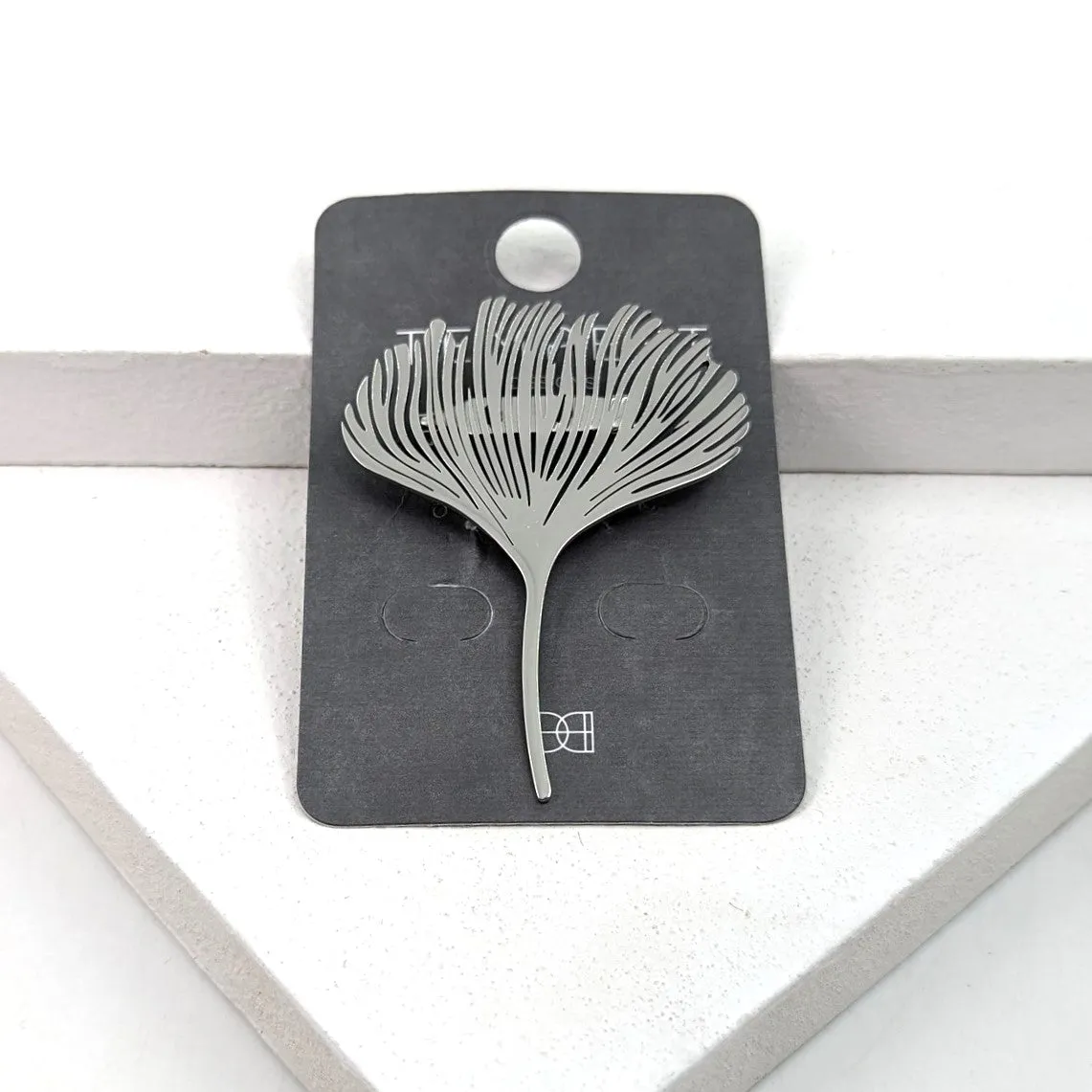 Contemporary feather like brooch
