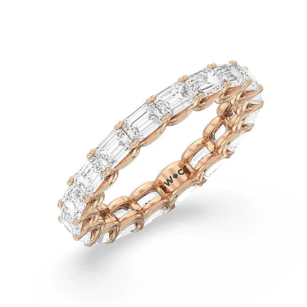 Emerald Split Prong Waves Eternity Ring