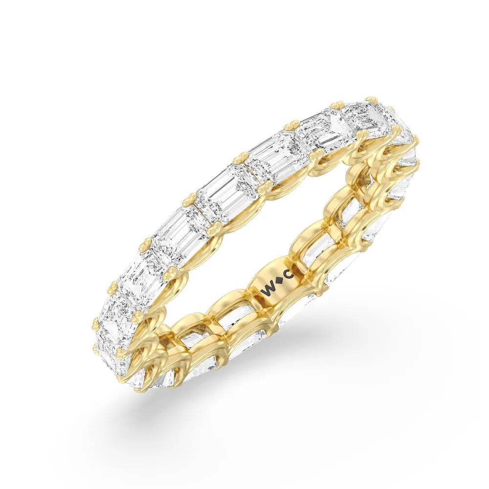 Emerald Split Prong Waves Eternity Ring