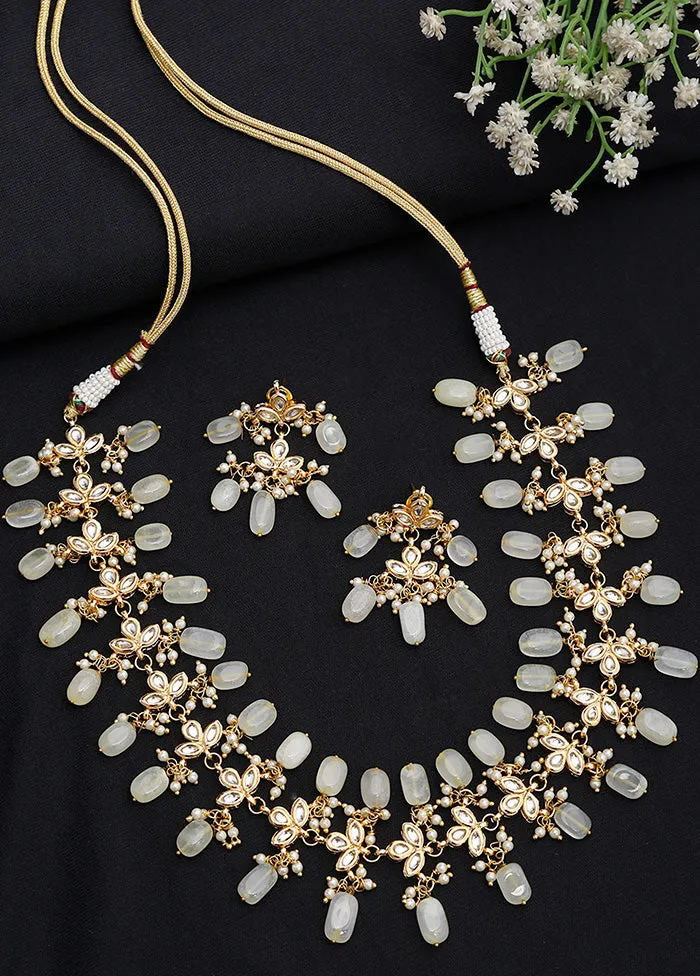 Gold Plated Kundan Jewellery Set With Off White Beads