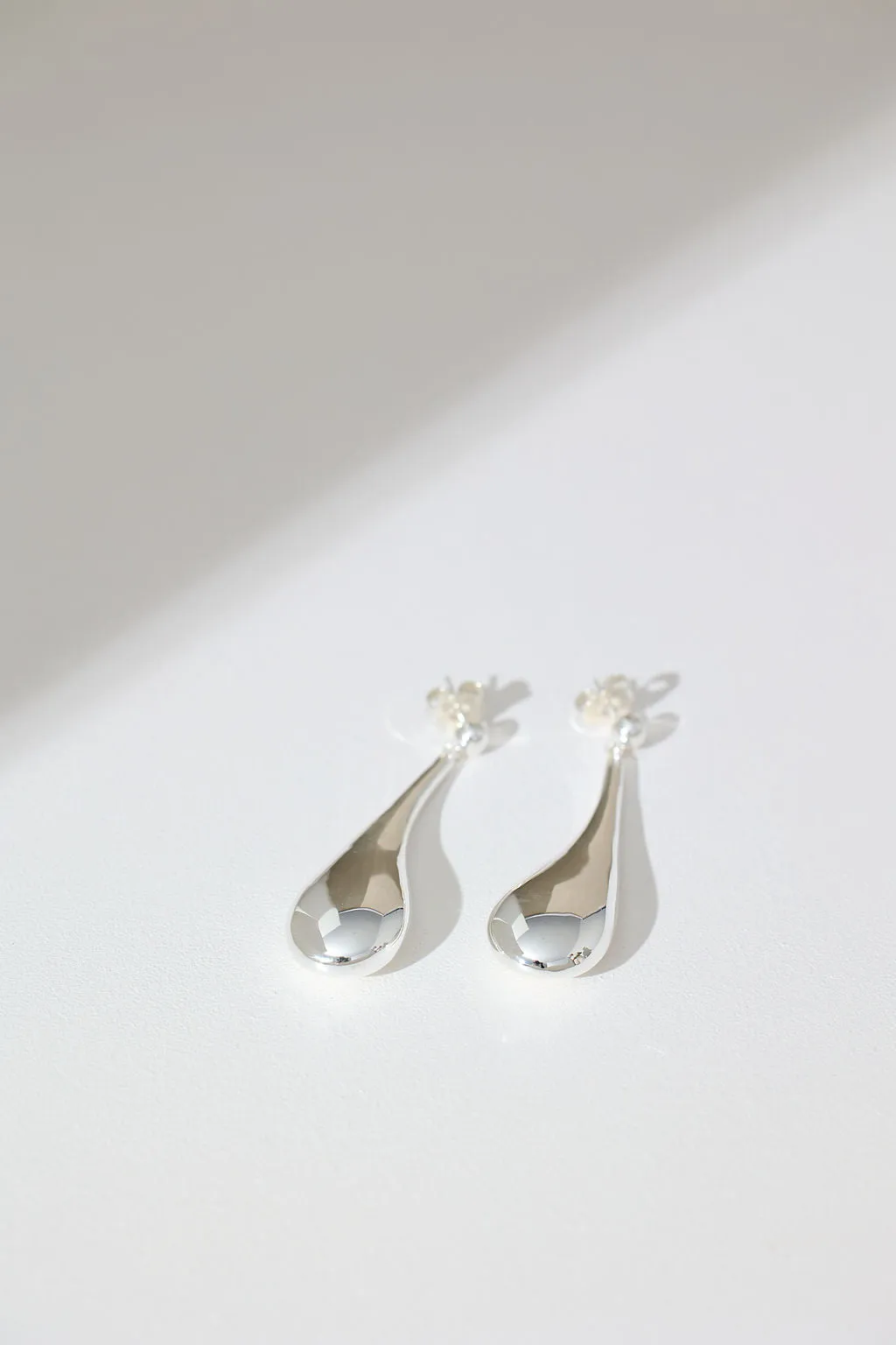 Long Hollow Form Tear Drop Earrings