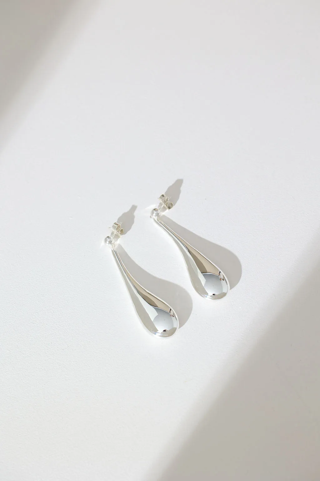 Long Hollow Form Tear Drop Earrings