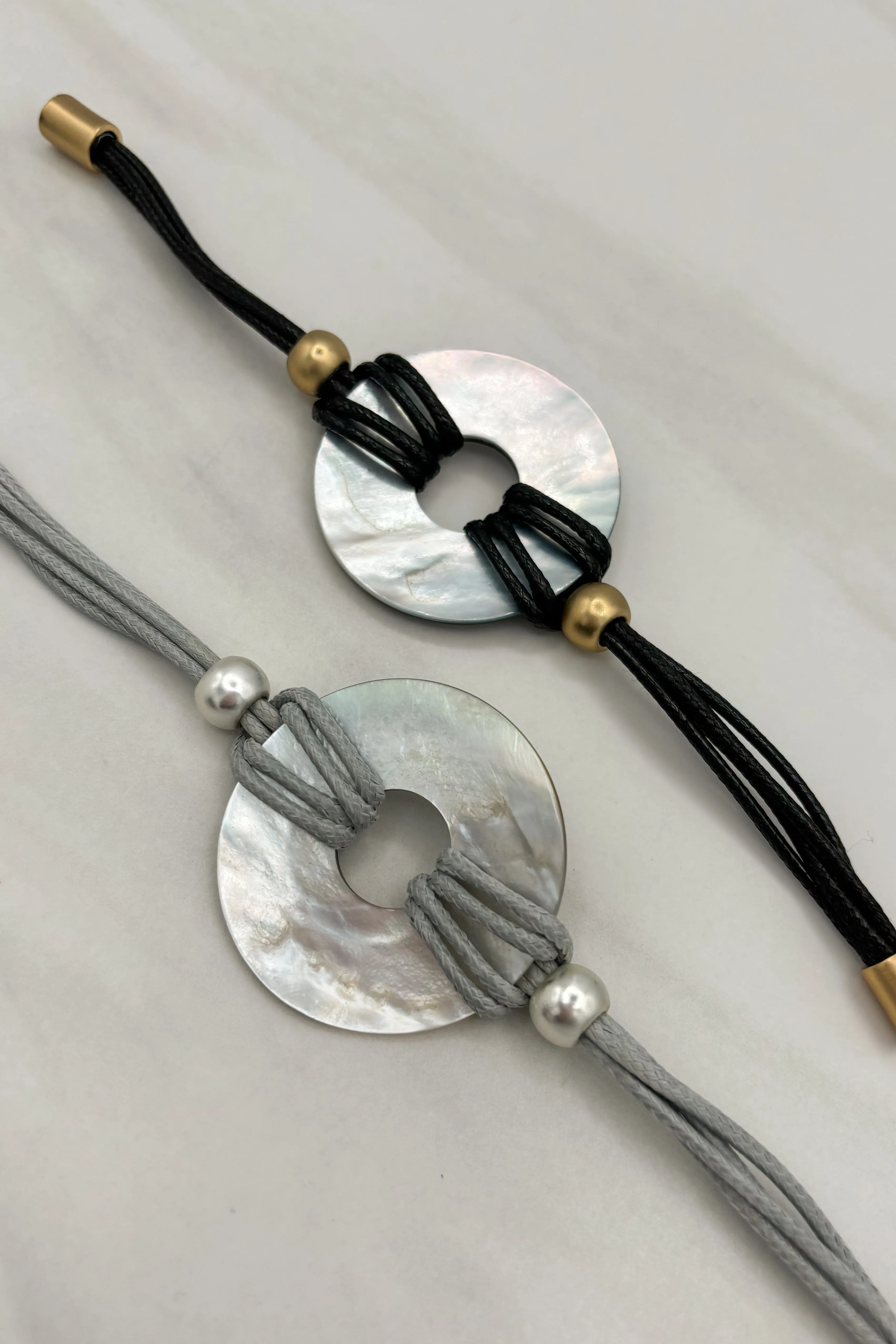 Multi Strand Cord Bracelet with Circle Shell Pendants