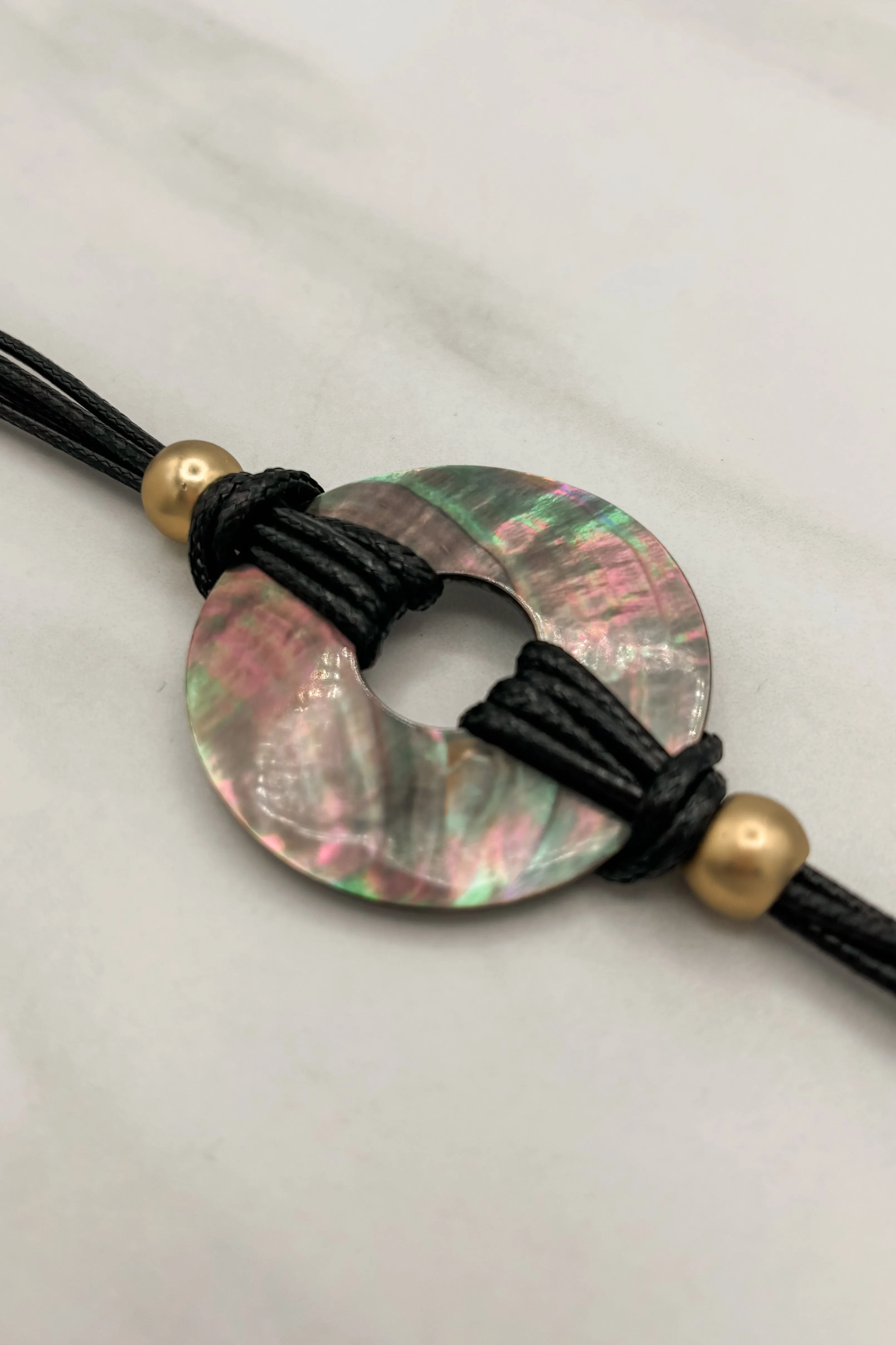 Multi Strand Cord Bracelet with Circle Shell Pendants